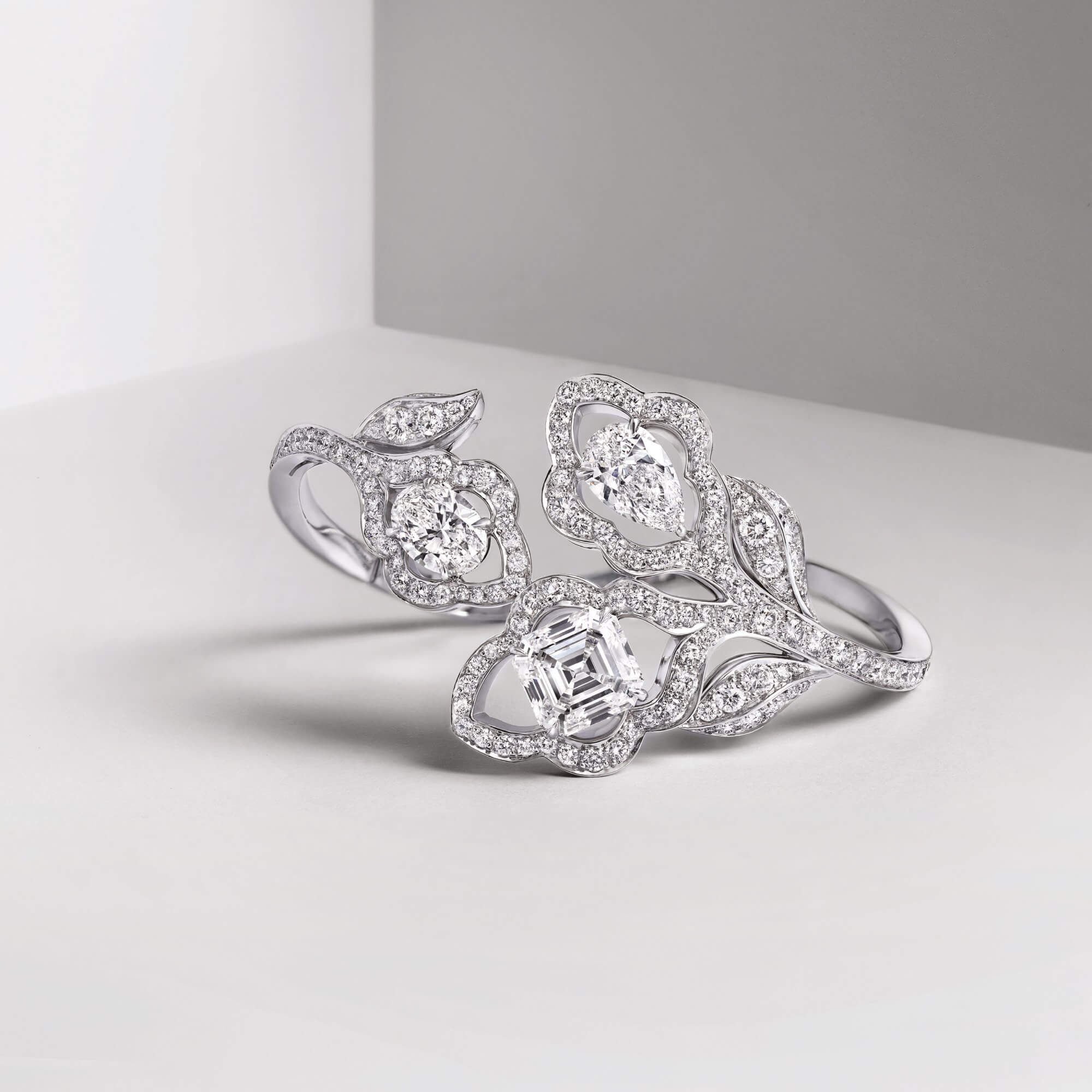 Graff diamond bracelet featuring a trio of pear shape oval and emerald cut diamonds