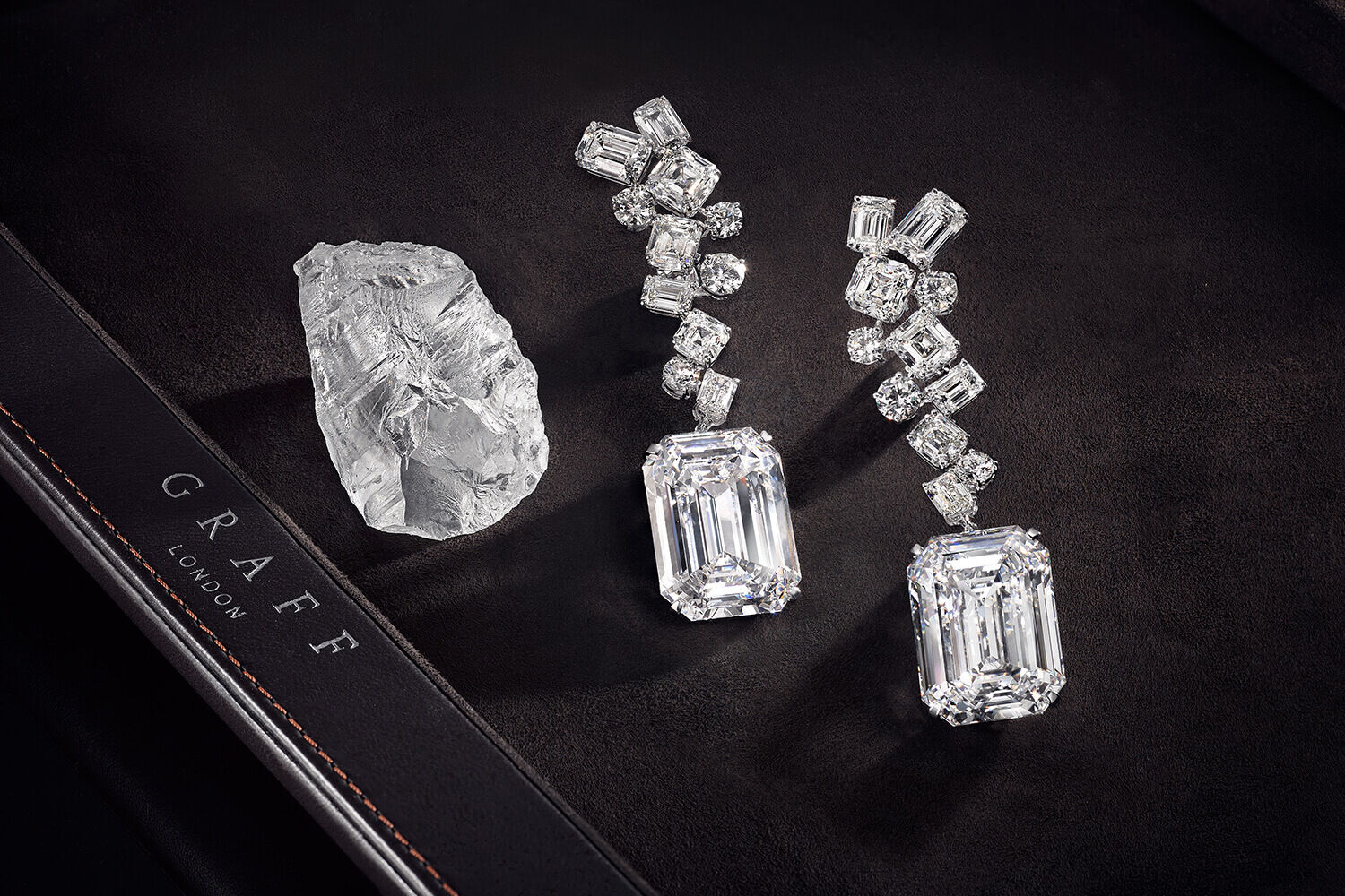 The Graff Eternal Twins - two identical D Flawless emerald cut diamonds weighing 50.23 carats each and the rough stone