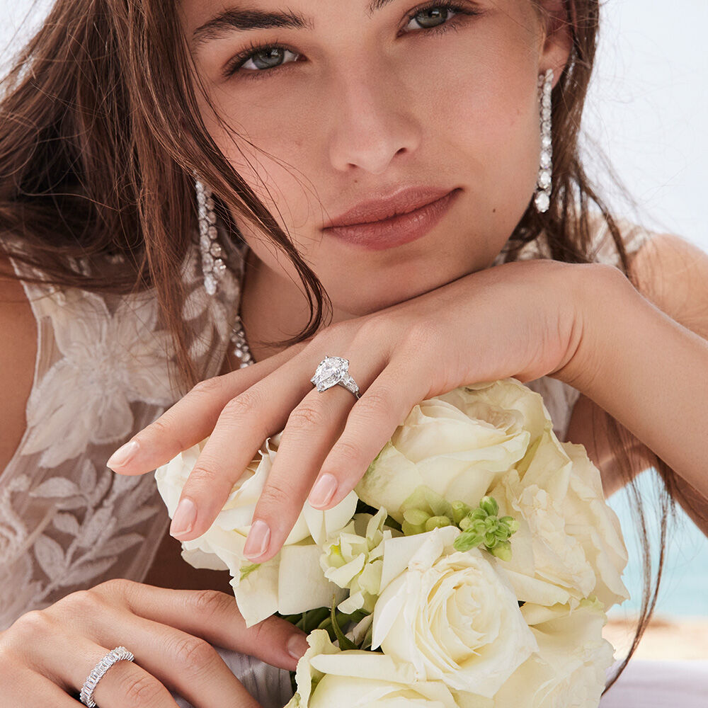 Model wears Graff eternity ring and engagement ring