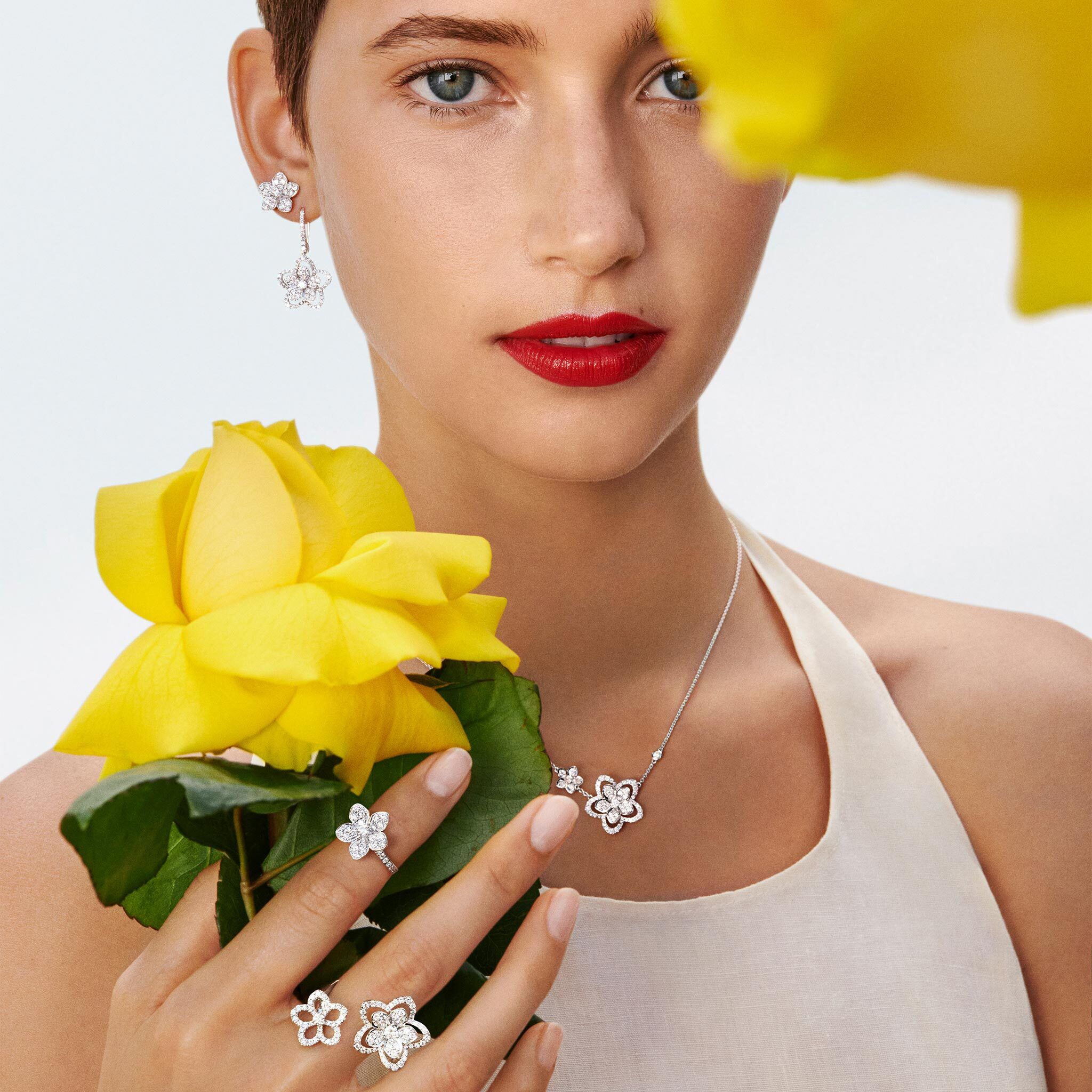 Model wearing earrings, pendant and ring from the Butterfly Silhouette Collection