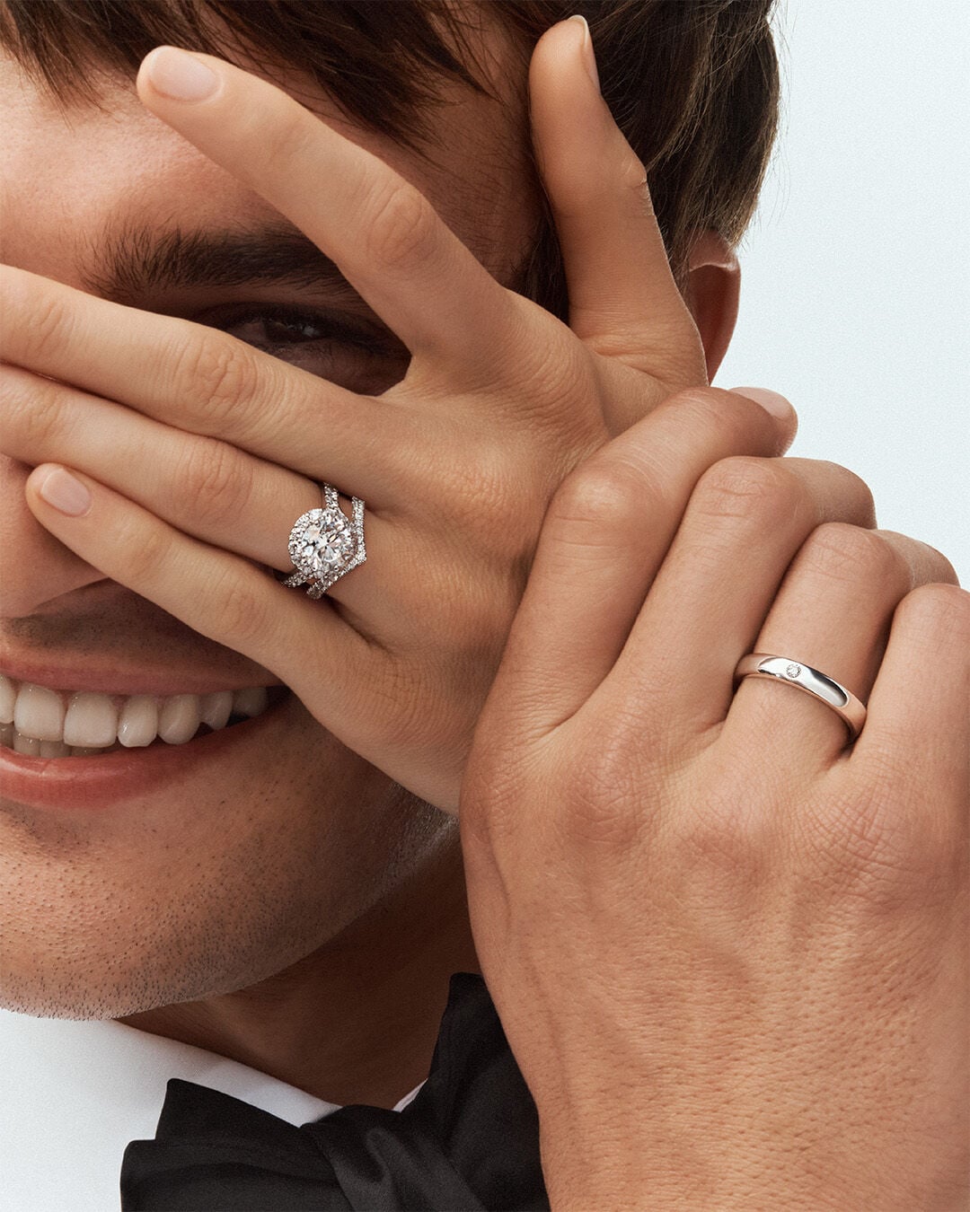 Wedding bands, image shows female and male model wearing Graff wedding bands