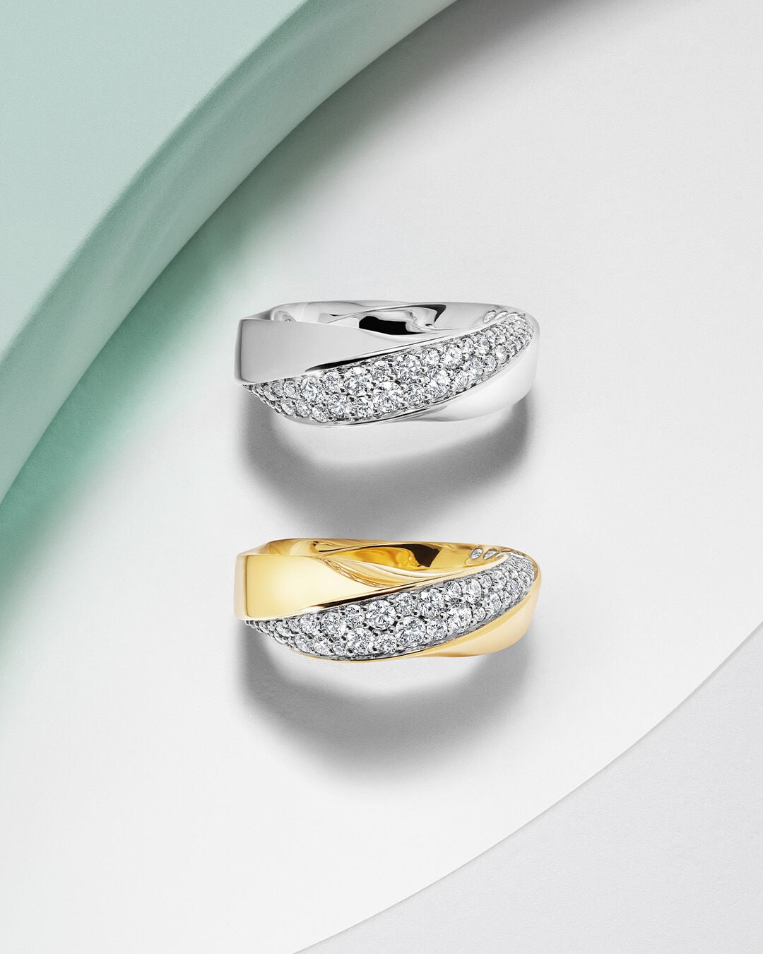 Image shows White Gold and Yellow Gold Spiral Rings