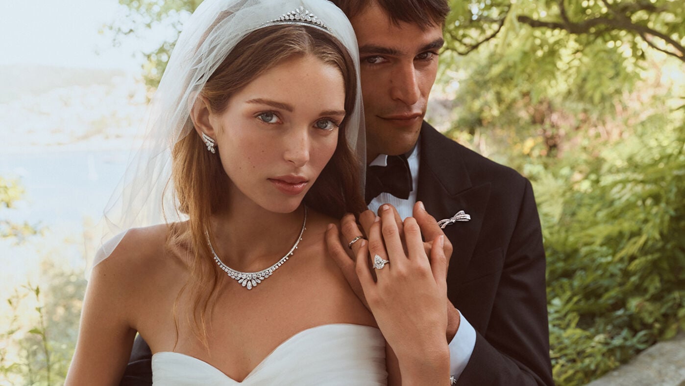 Engagement and Bridal - image shows couple wearing Graff bridal jewellery and Graff diamond engagement ring.
