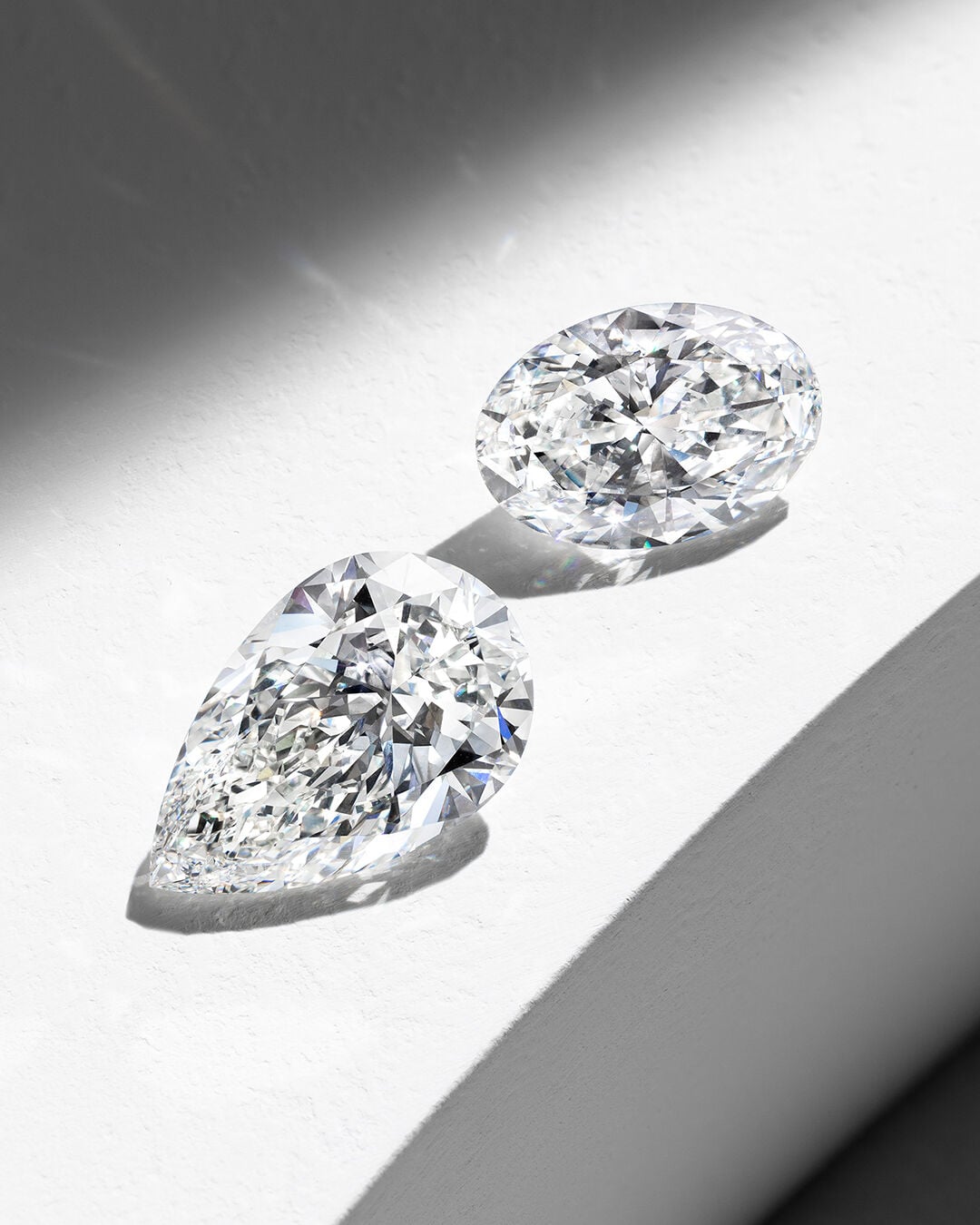 Image shows loose Graff Pear Shape and Oval Cut diamond