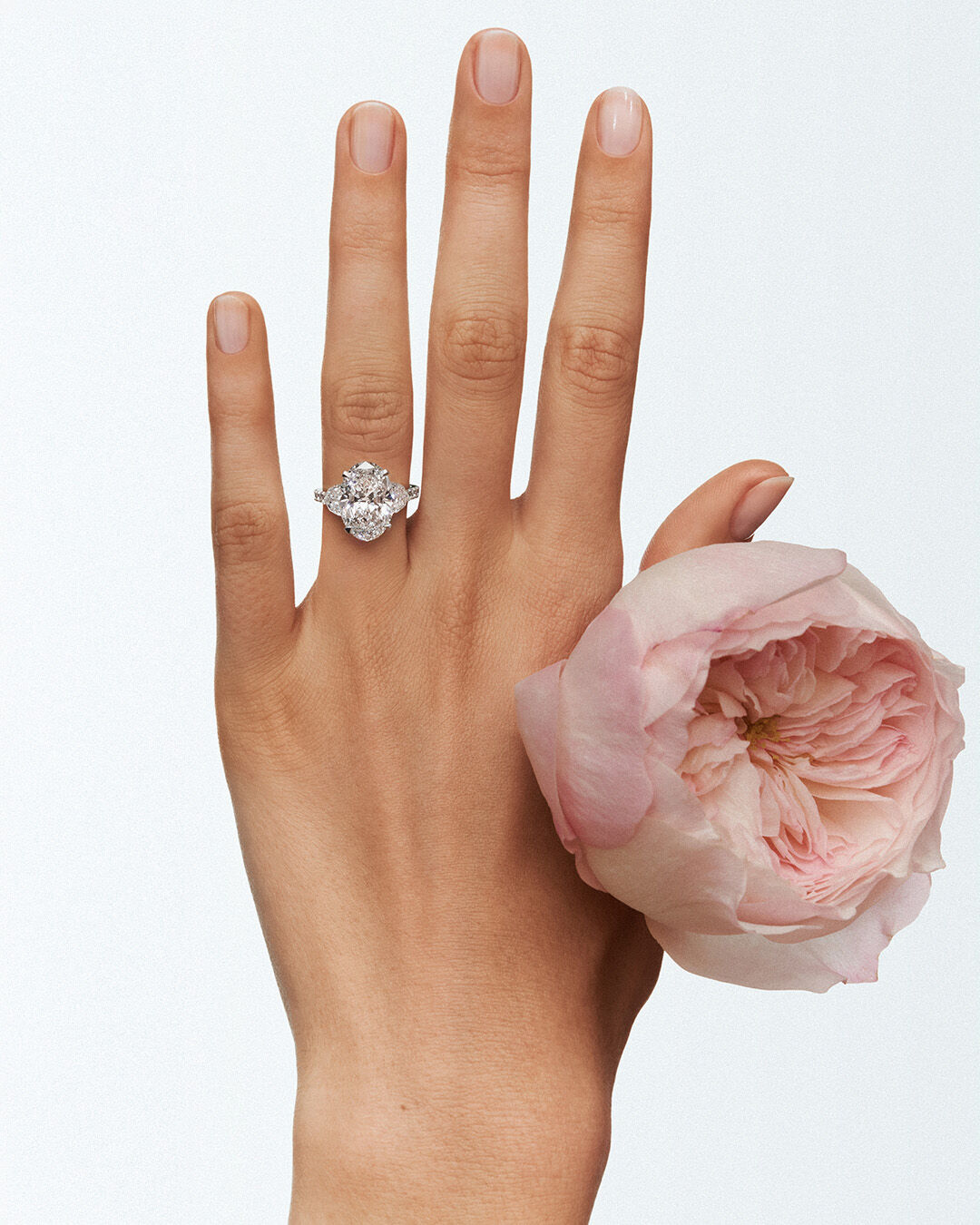 Image shows model wearing Graff Oval Cut Promise Diamond engagement ring