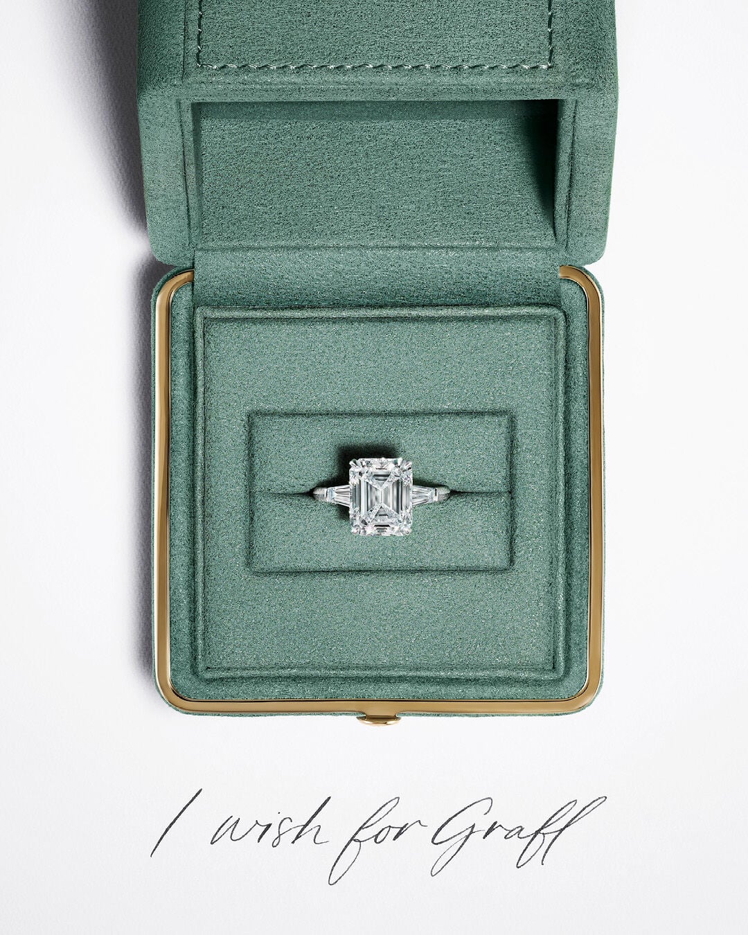 Engagement Rings - image shows Graff Emerald Cut Promise Engagement Ring in Graff ring box