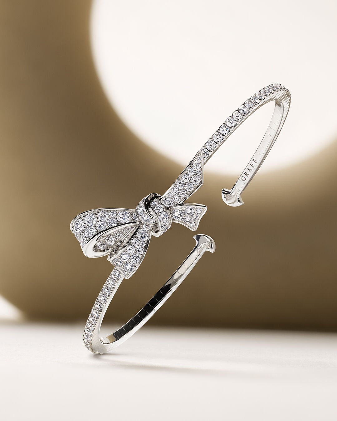 Image shows model wearing Laurence Graff Signature rings and bangles