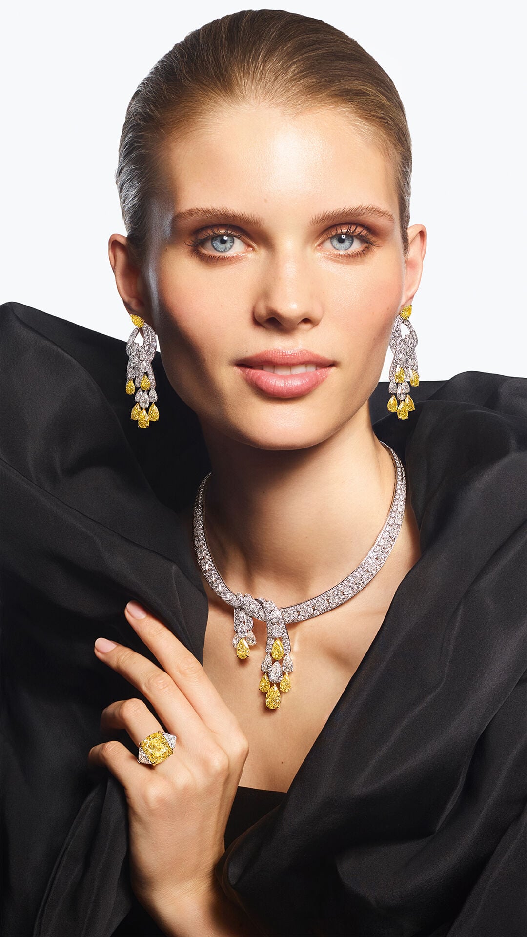 Image shows model wearing Graff Yellow Diamond High Jewellery suite