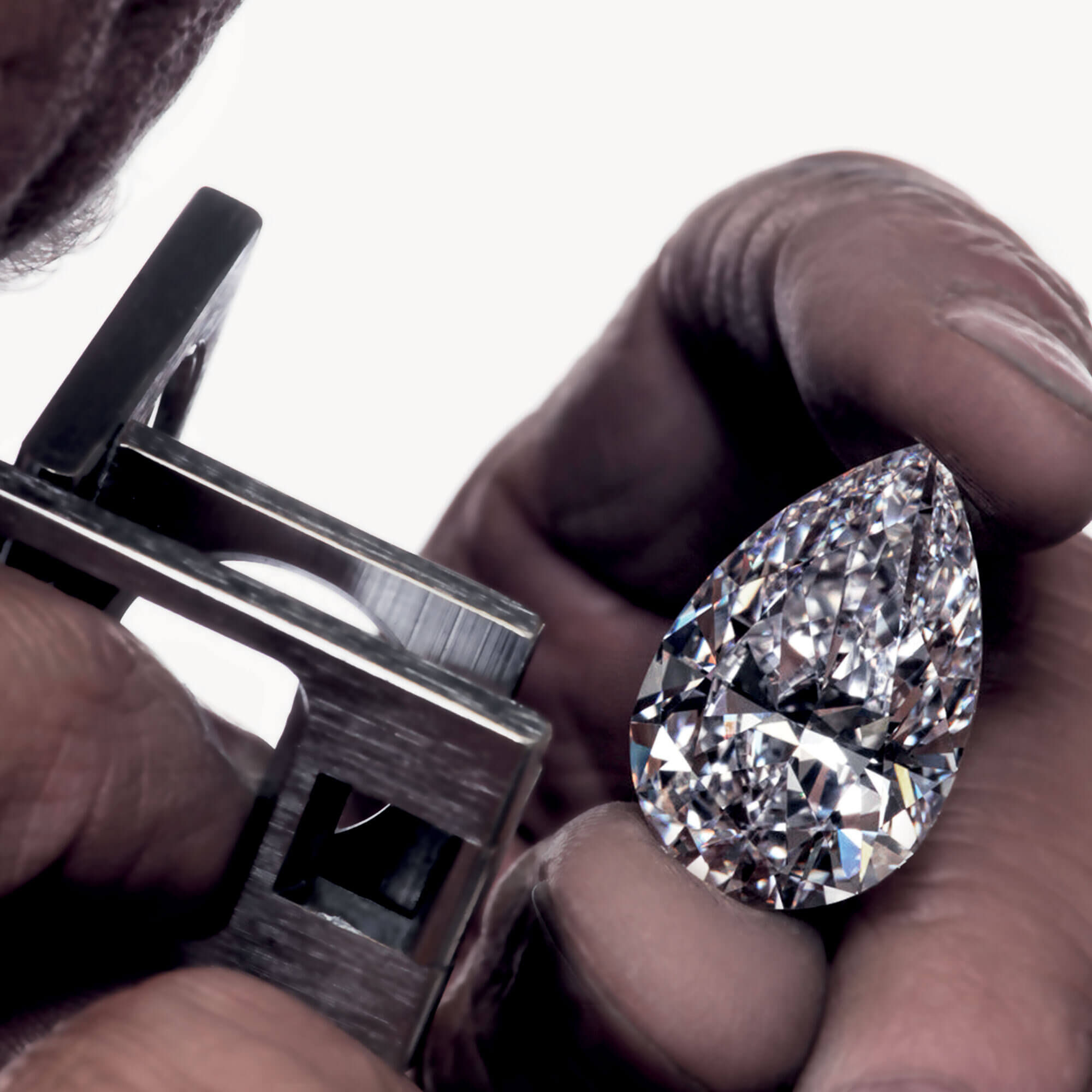 Close up of the Graff Vend&ocirc;me pear shape diamond under examination 
