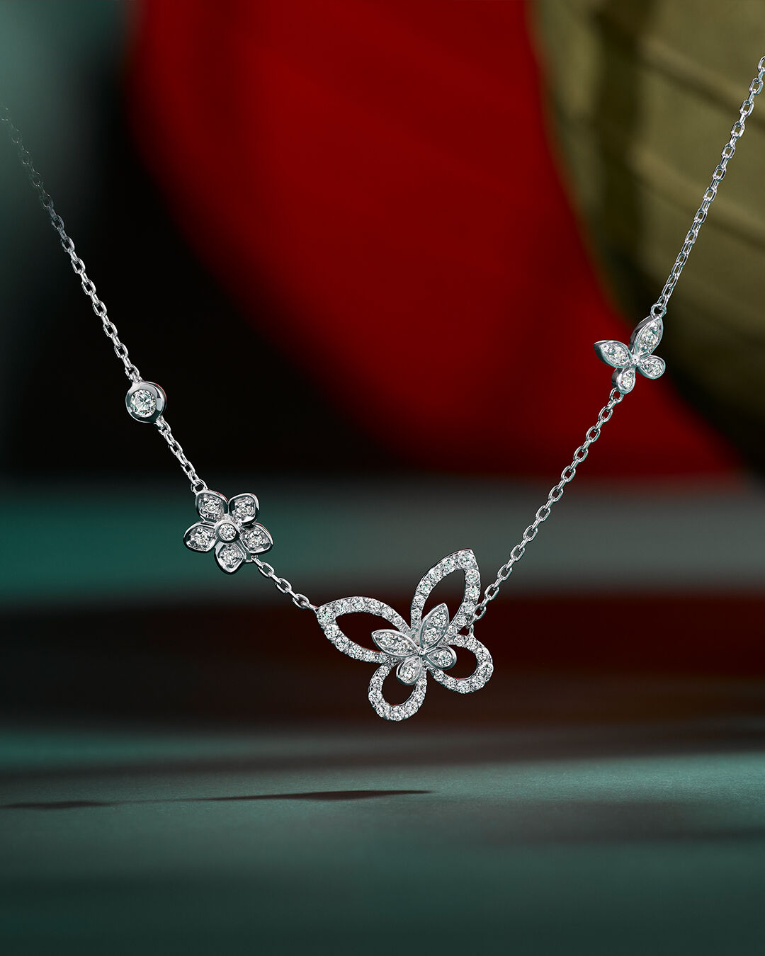 Image shows Butterfly Silhouette & Flower Diamond Pendant