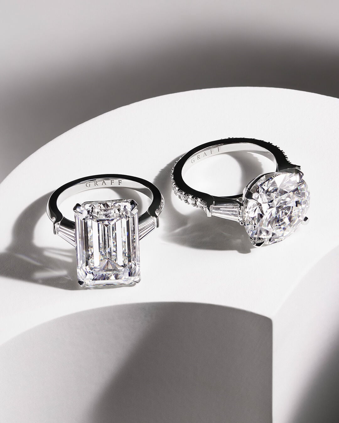 Image shows Graff Emerald Cut and Round Cut Diamond Engagement rings