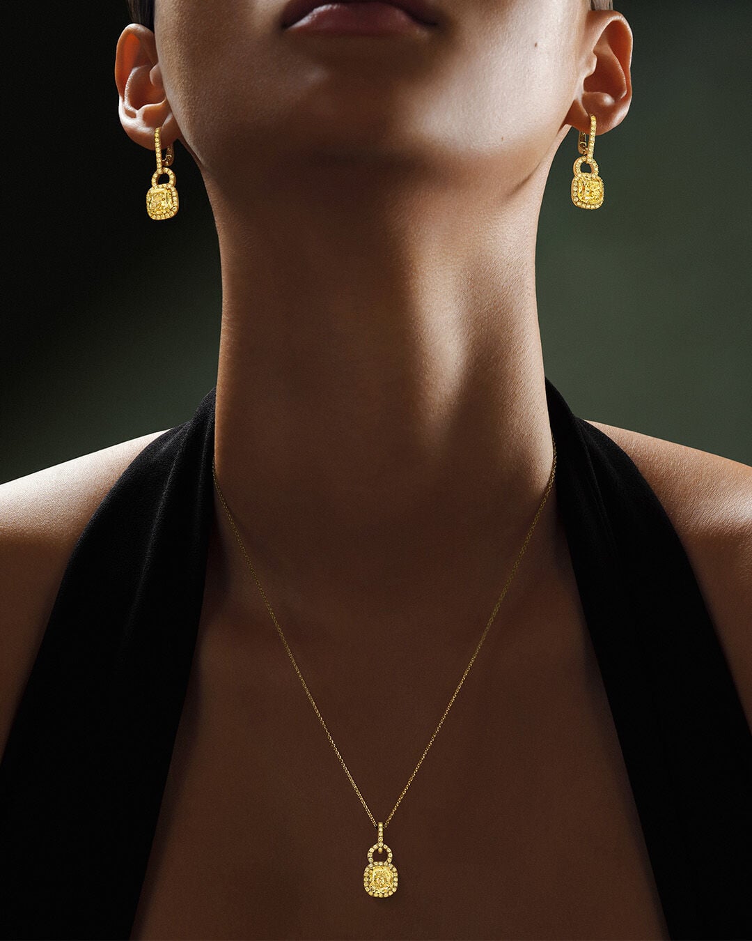 Image shows model wearing Classic Graff Diamond Emerald cut bracelet and eternity ring