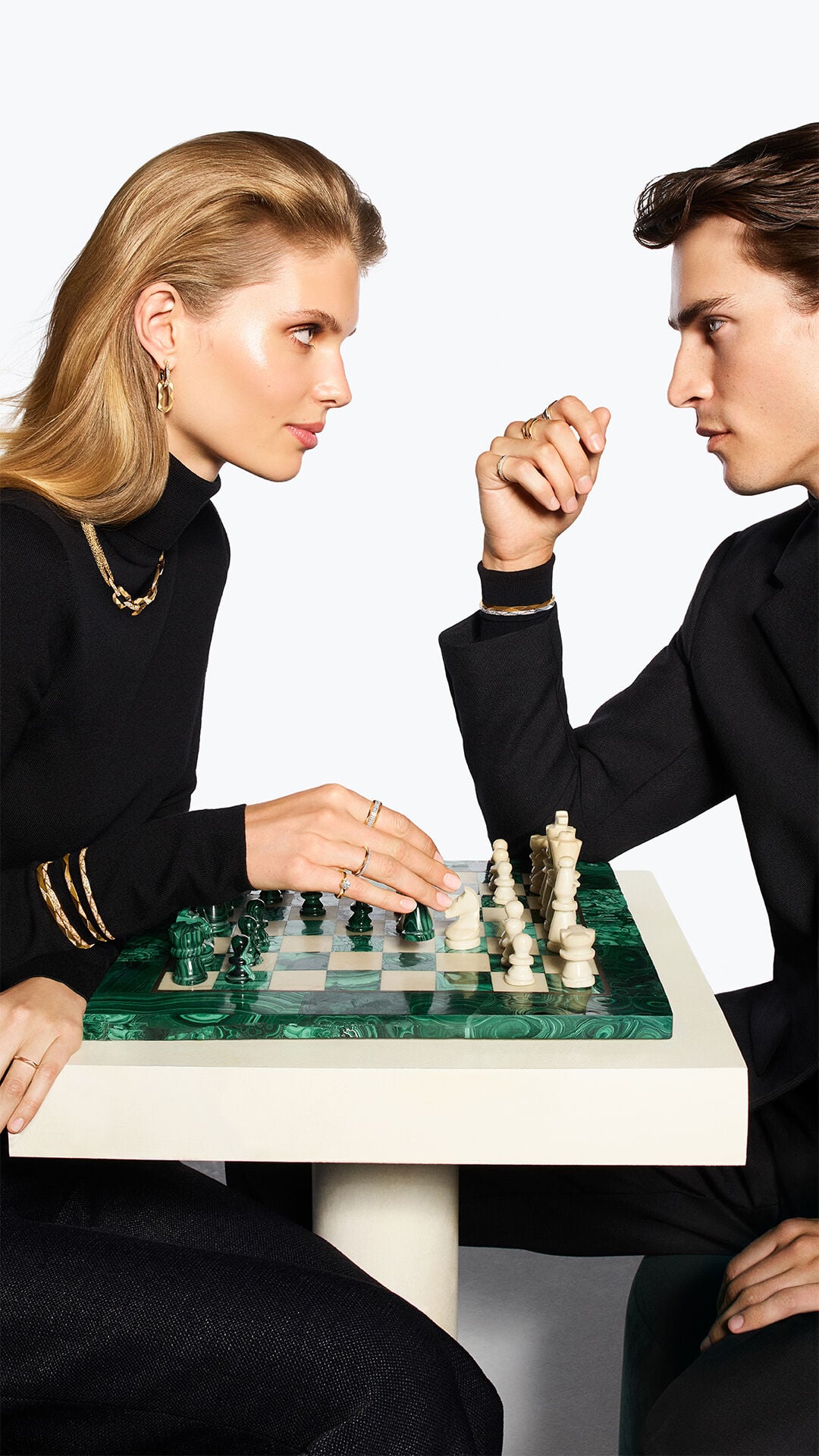 Image shows female and male model wearing Laurence Graff Signature collection jewellery