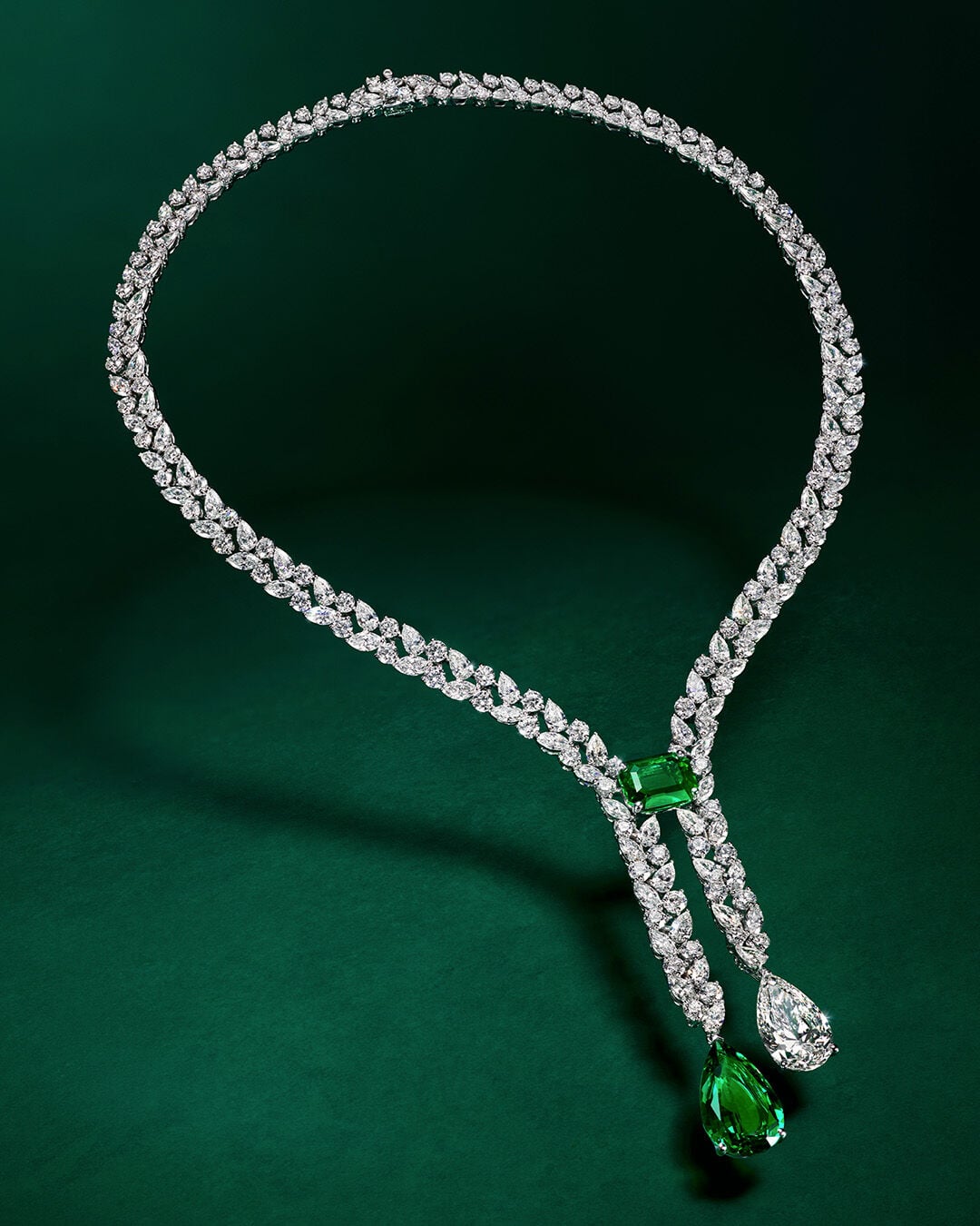Image shows Graff Emerald and White Diamond High Jewellery bangle being created in Graff workshop