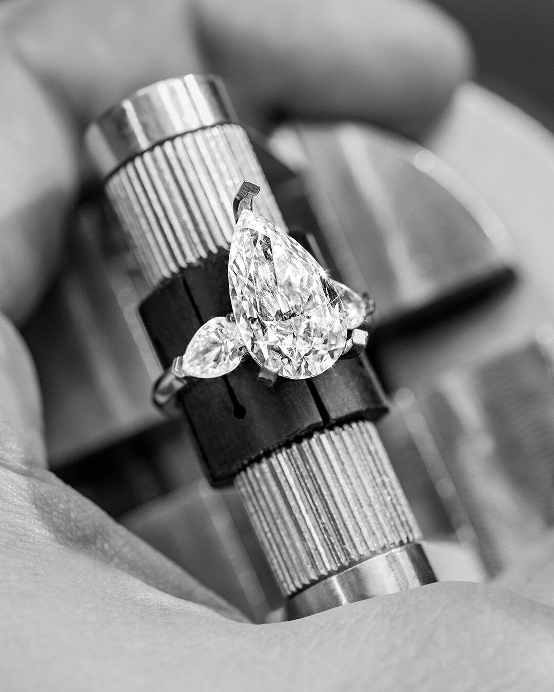 Image shows creation of Graff Pear Shape Promise diamond engagement ring in Graff workshop