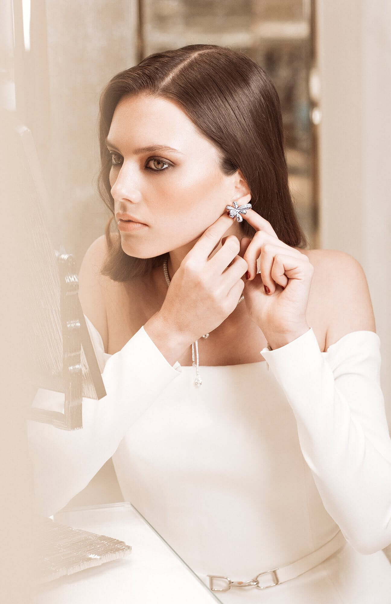 A model wearing Graff Inspired by Twombly diamond warrings and necklace in the Paris Flagship store