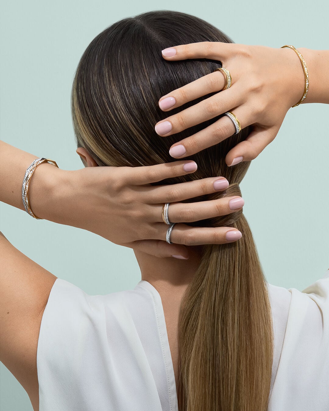 Image shows model wearing Laurence Graff Signature rings and bangles