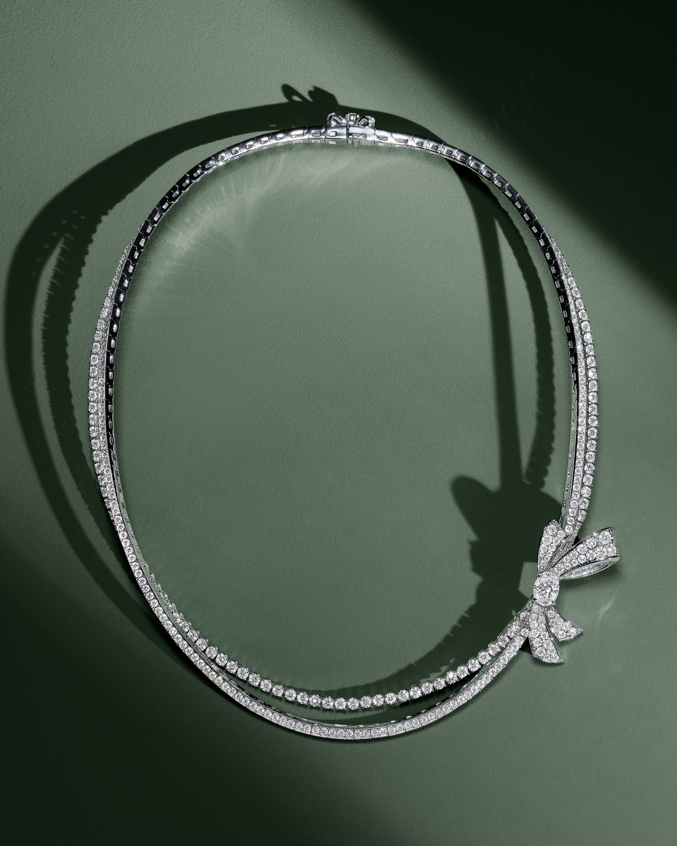 Image shows model wearing Graff Tilda's Bow Necklace and Earrings