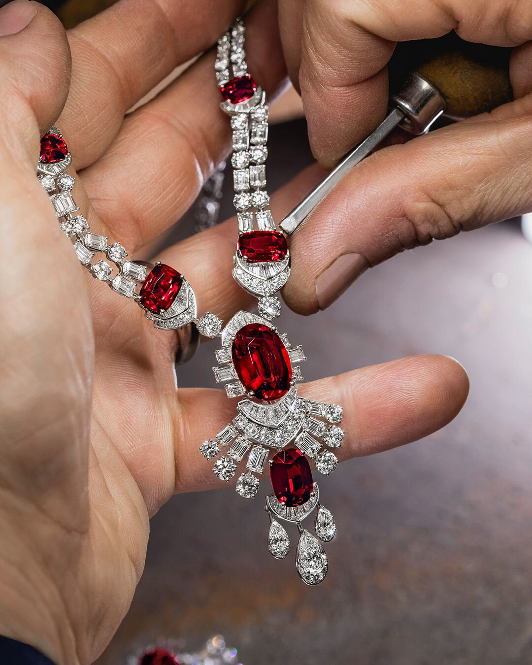 Image shows Graff Ruby High Jewellery necklace being created in Graff workshop