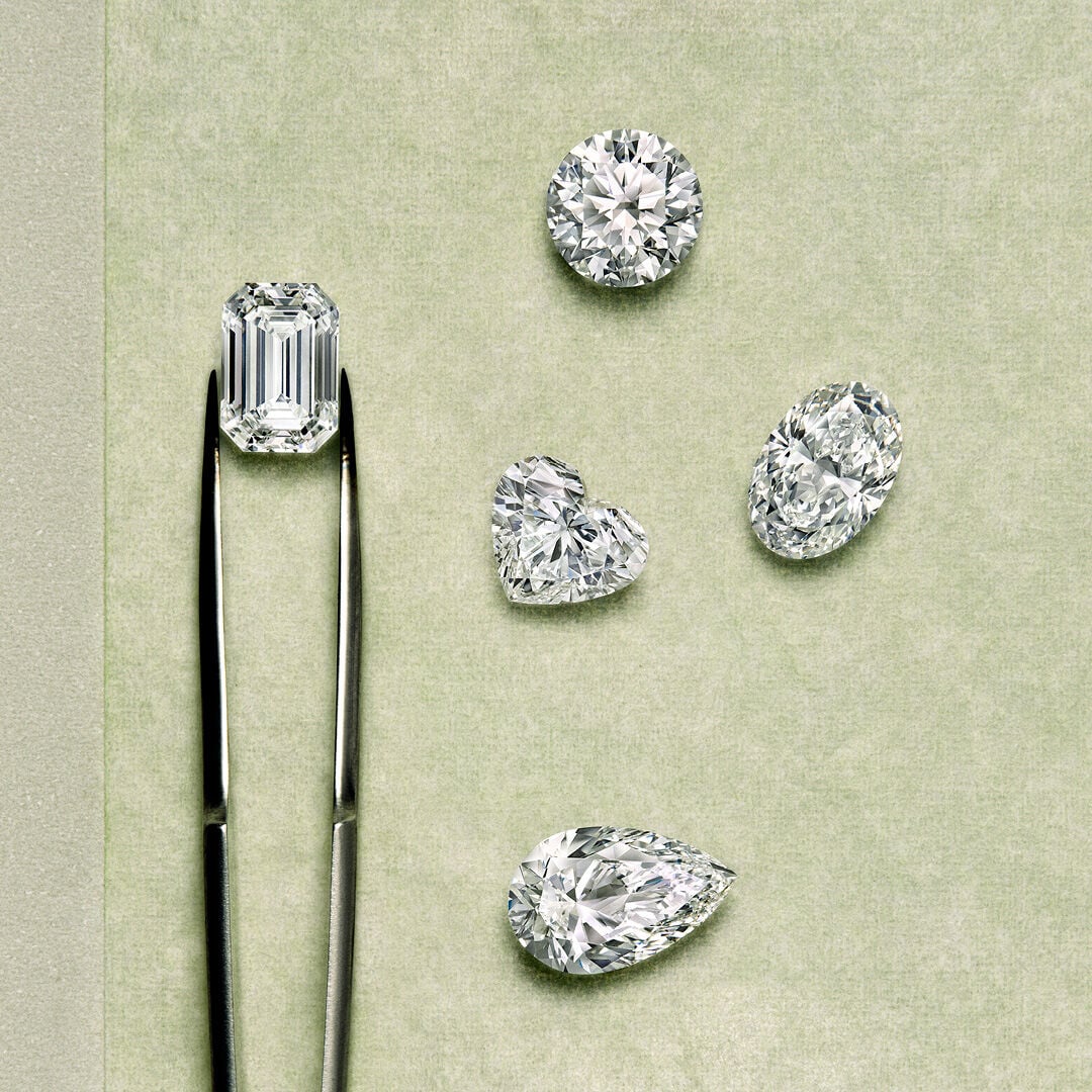 A Guide to Diamond Certification - Image shows Graff diamond engagement ring and workshop tools.