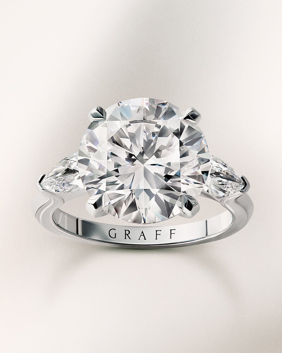 Image shows Graff Emerald Cut and Round Cut Diamond Engagement rings