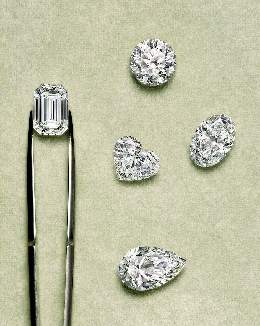Guide to diamond certification - image shows Graff diamond engagement ring and workshop tools