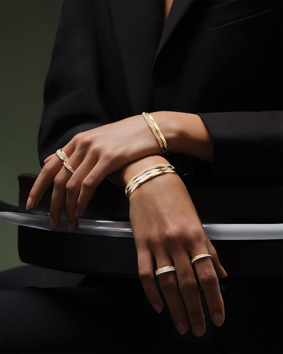 Image shows model wearing Laurence Graff Signature bangles and rings 