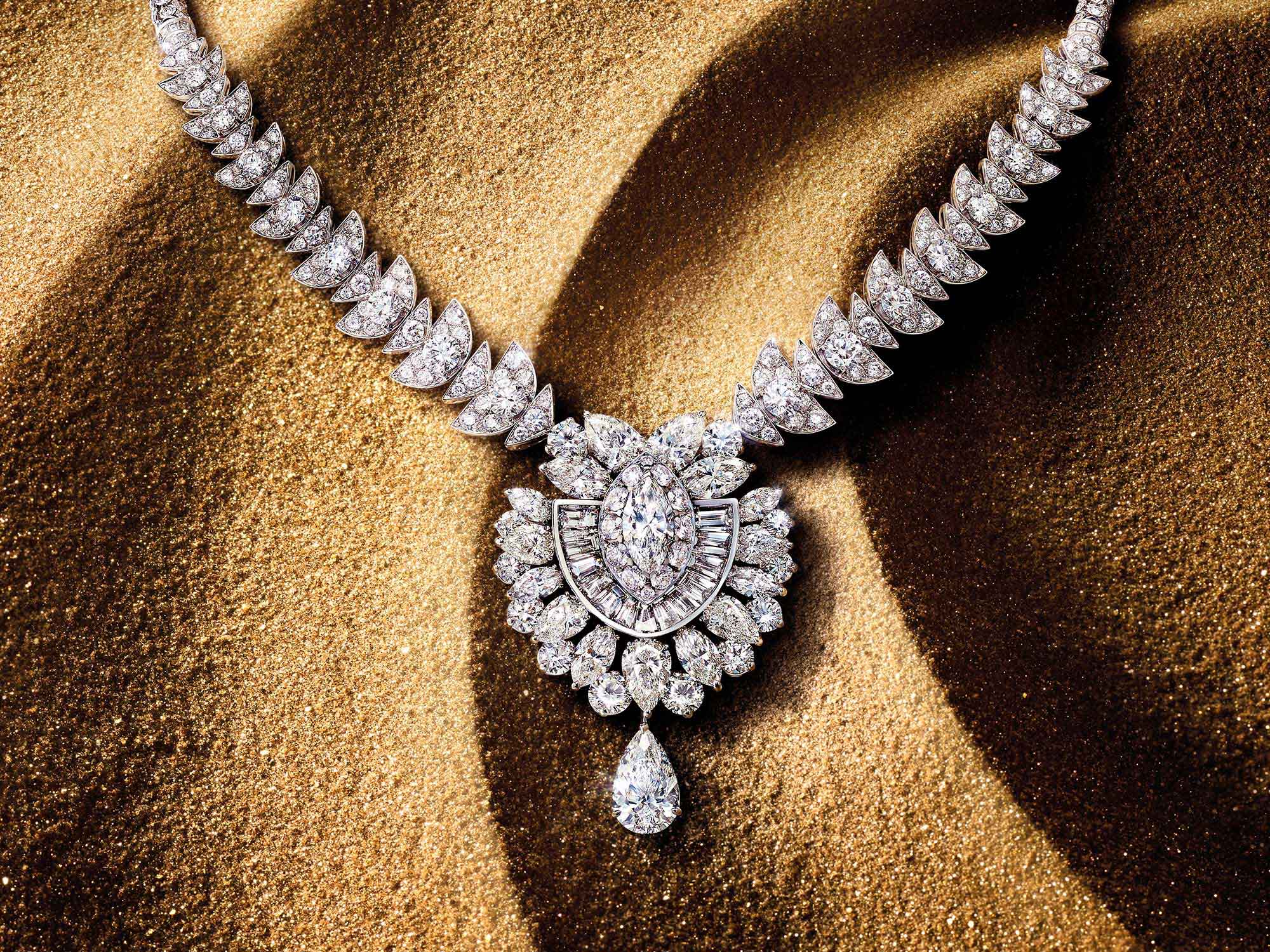 The Graff Night Moon diamond high jewellery necklace from the Tribal jewellery collection, on sand
