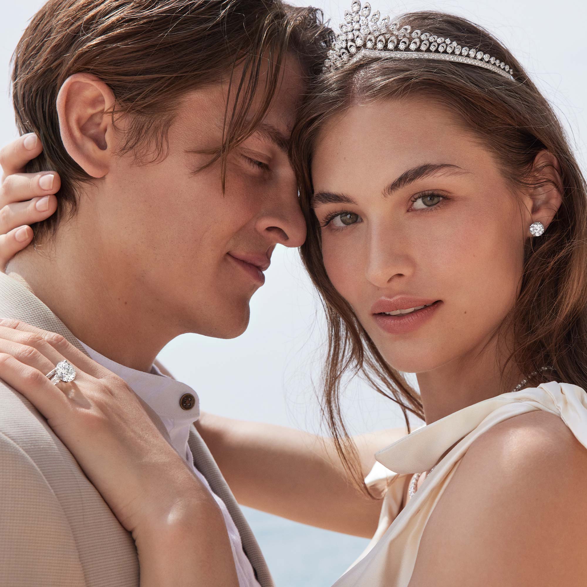 Bride wearing Graff Promise Emerald Cut Diamond Engagement Ring, Graff Emeral cut diamond bracelet, Graff Emerald Cut Diamond Earrings and Graff Emerald Cut Diamond Wedding Band.