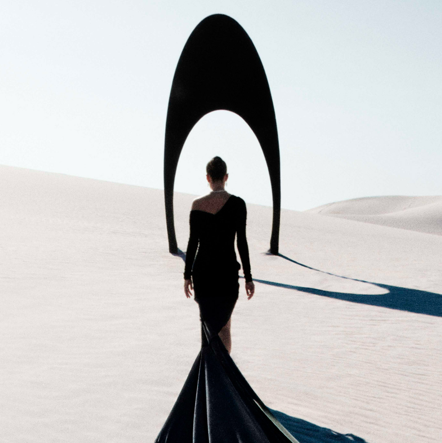 Silhouette of a model in the dessert, wearing Graff Tribal diamond jewellery