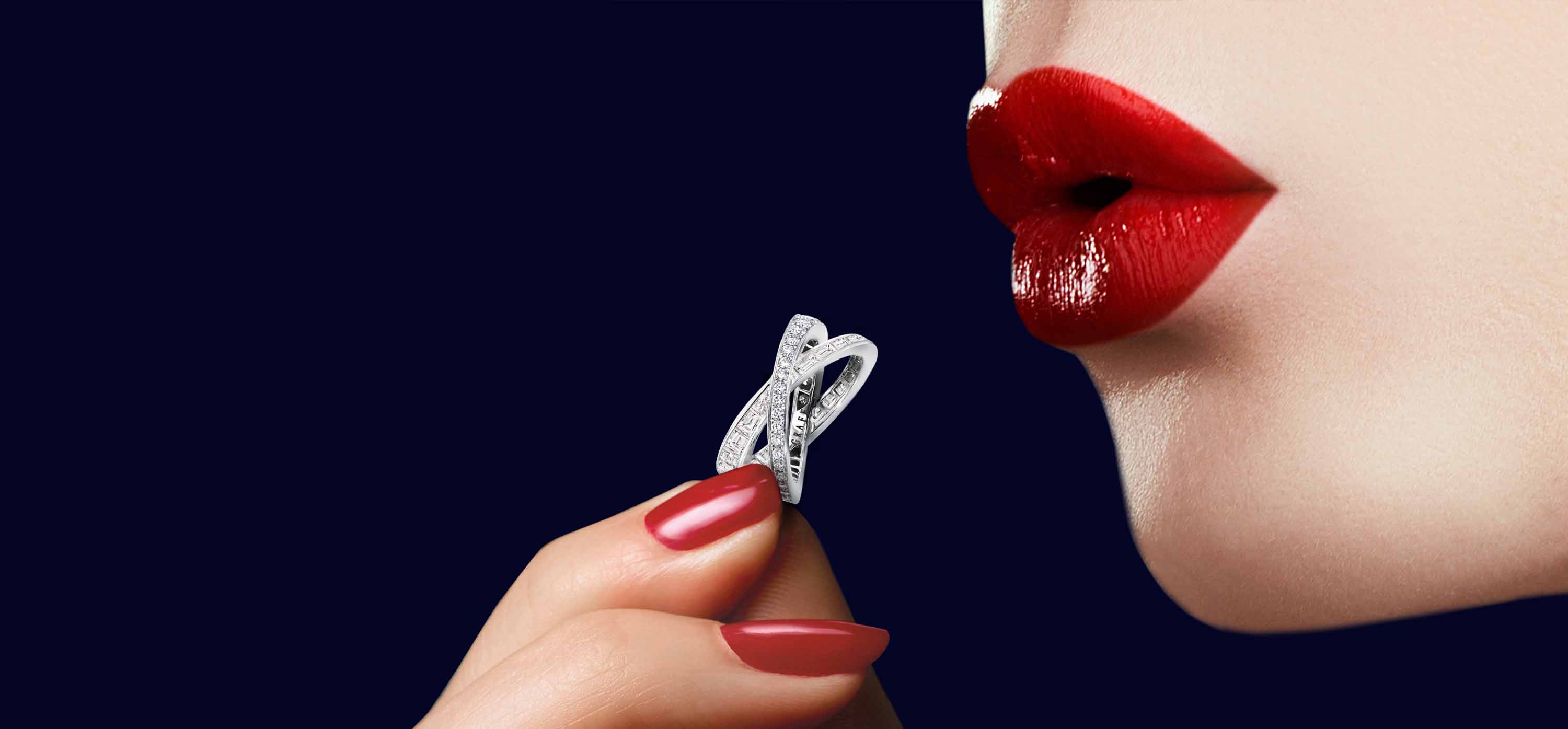 Model holding Kiss Pavé Baguette and round Diamond Ring from the Graff Kiss Jewellery Collection