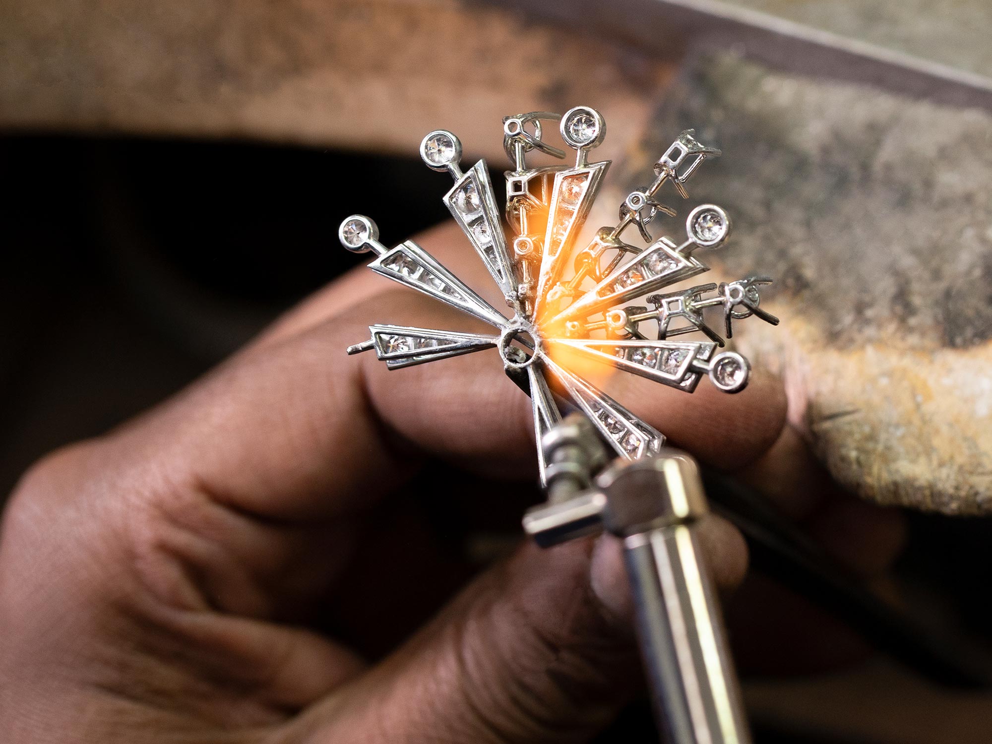 Close up of a Graff craftsman making a New Dawn motif from the Tribal jewellery collection in the workshop