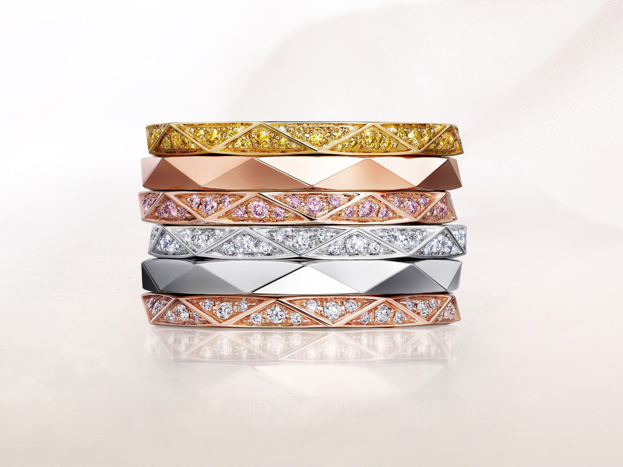 Stacked Laurence Graff signature bands in white Gold and rose gold, set with dIamond paves or plain